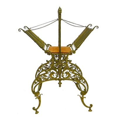 Lot 1820 - A heavy brass folding magazine rack.