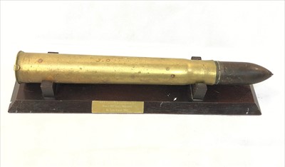 Lot 310 - A recovered brass shell, the modern stand with...