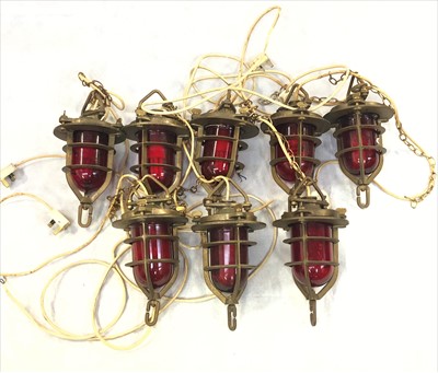 Lot 332 - A group of eight ship's type brass lights,...