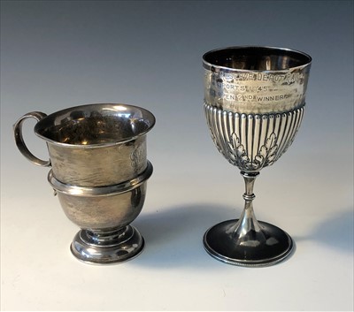 Lot 2061 - A fluted silver goblet together with a footed...