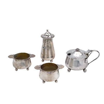 Lot 275 - An Edwardian silver Art Nouveau cruet set by Lloyd, Paine & Amiel.