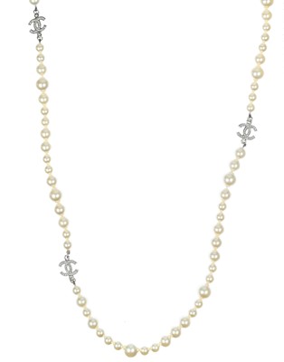 Lot 576 - A Chanel faux pearl and gold-tone CC crystal set necklace.