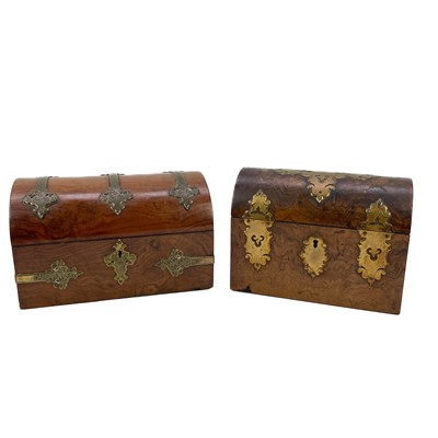 Lot 230 - A Victorian walnut brass bound domed casket.