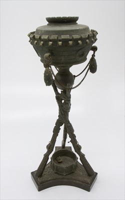Lot 395 - An unusual oil lamp, the chimney a castellated...