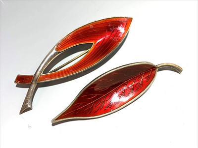 Lot 2612 - Two Danish silver and red enamel brooches, one...