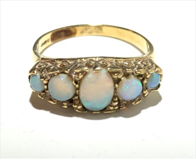 Lot 2586 - A 9ct gold ring set five opals.
