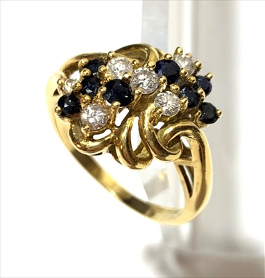 Lot 2591 - A contemporary 18ct diamond and sapphire ring.