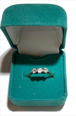 Lot 2594 - A three stone diamond ring.