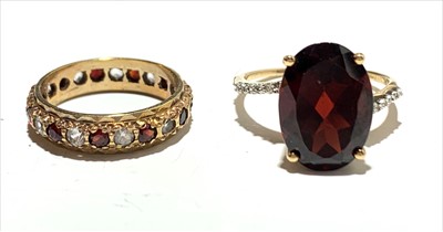 Lot 2579 - Two red stone set rings.