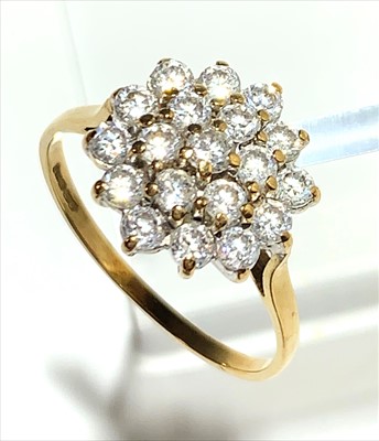 Lot 2584 - An 18ct white gold diamond flowerhead cluster...
