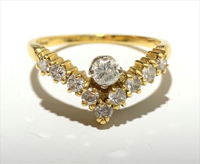 Lot 2577 - An 18ct gold wishbone ring set with diamonds.