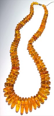 Lot 2479 - An amber submarine bead necklace, length 74.5cm.
