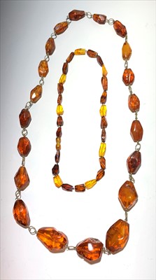 Lot 2619 - Two amber necklaces, lengths 83cm and 46.5cm.