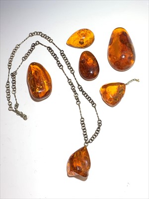 Lot 2596 - An amber pendant necklace and five other...