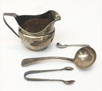 Lot 2098 - A silver helmet cream jug with reeded rim and...
