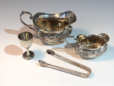Lot 2093 - A floral and acanthus decorated silver cream...