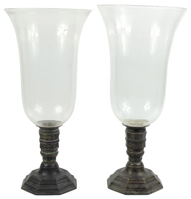 Lot 152 - A pair of brass candlesticks with  enormous bell shaped glass shades