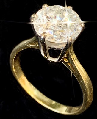 Lot 2414 - A solitaire diamond ring set in 18ct yellow...
