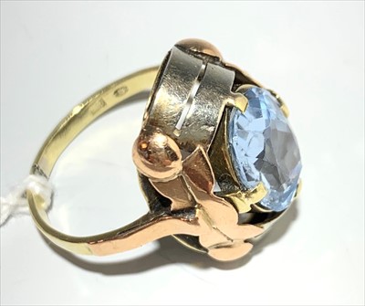 Lot 2416 - An aquamarine and gold ring.