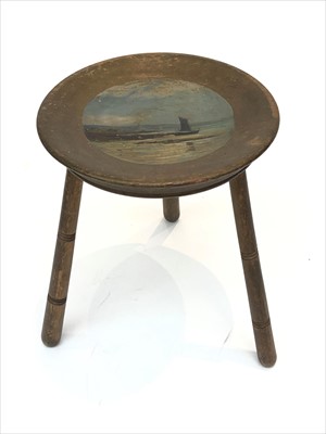 Lot 415 - A wood stool on ring turned legs, the dished...